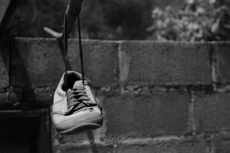 Old,Sneakers,Hanging,On,A,Rope,,Black,And,White,Picture