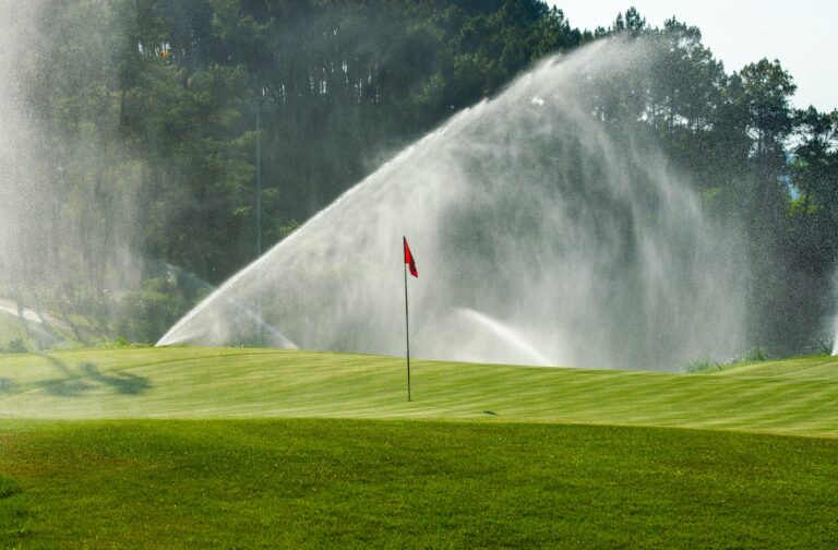 Golf,Course,In,Maintenance,,Watering,The,Golf,Course,,Sprinkler