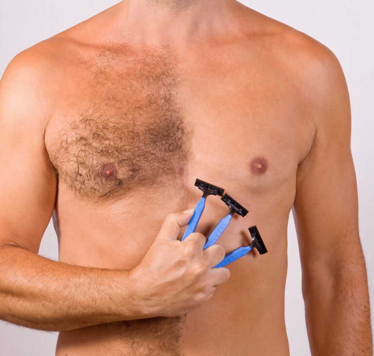 Man,With,Razor.,Unshaven,Male,Chest.,Man,Shaves,His,Chest.