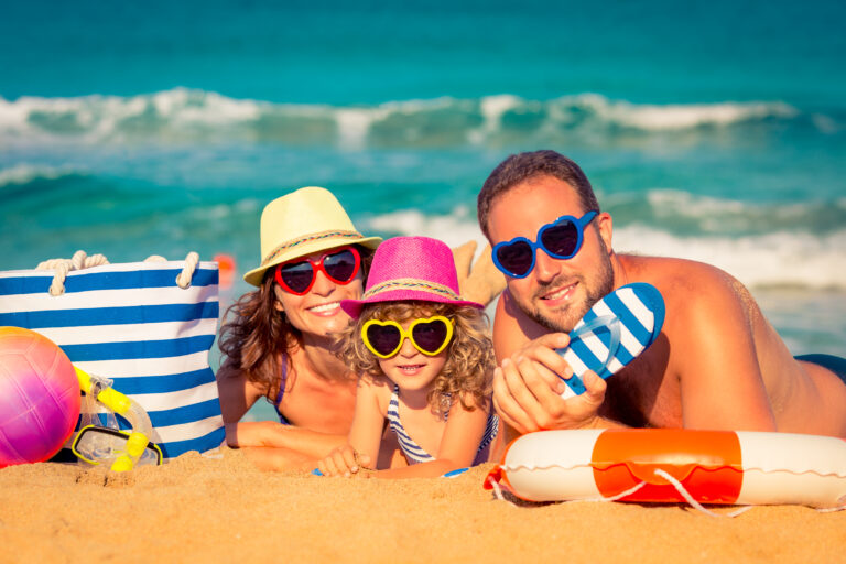Happy,Family,Playing,At,The,Beach.,Summer,Vacation,Concept