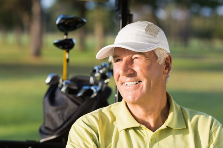 Close-up,Of,Smiling,Golfer,Man,Sitting,In,Golf,Buggy